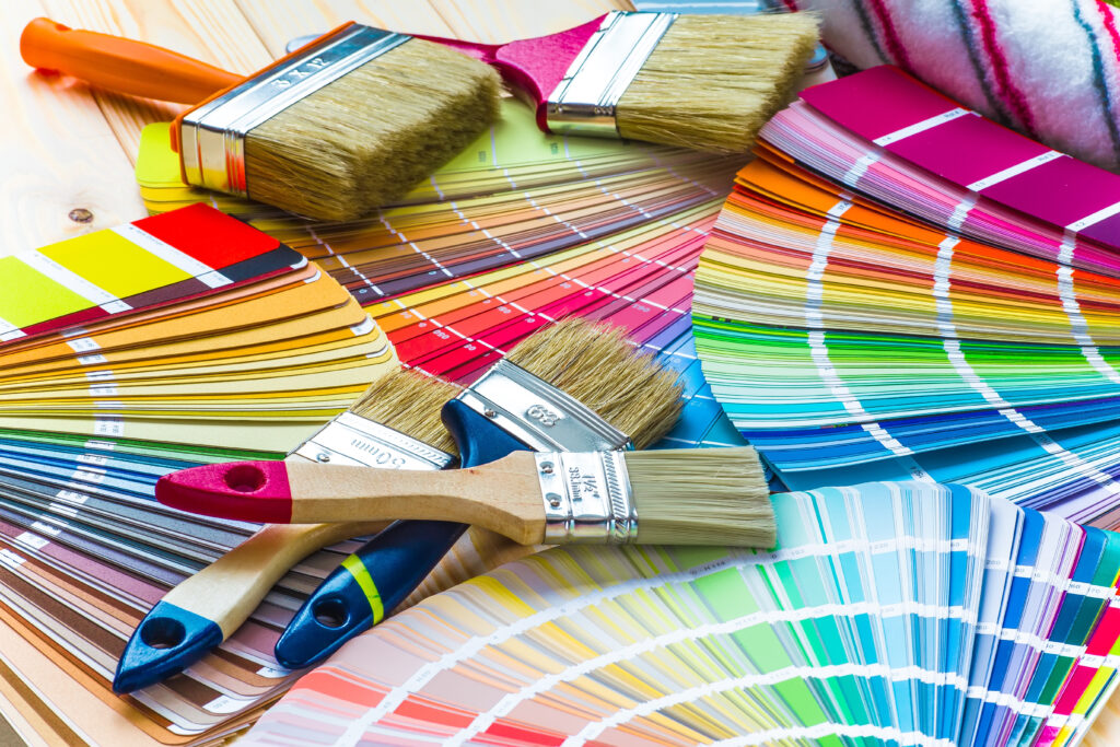 Paint colour chips with paint brushes - interior design