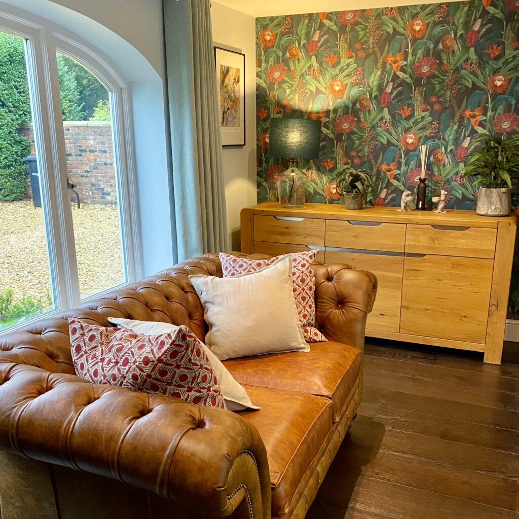 Lounge room with sofa, lamp and sideboard